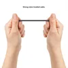 Hands holding a braided USB-C cable. Produktbild-Vorschau