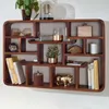 A wooden wall shelf filled with various decorative items and books. Voir les images du produit