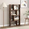 A bookshelf filled with decorative items and books, placed in a room with a floor lamp and a side table. Podgląd zdjęcia produktu