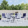 An outdoor patio setting with a dining table and chairs. Anteprima dell’immagine prodotto
