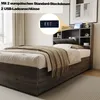 A bedroom scene featuring a bed with a headboard that has integrated storage and charging ports. Náhľad obrázku produktu
