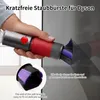 A hand holding a vacuum cleaner attachment with soft brushes, cleaning a dark, reflective surface. The attachment has a red and gray body with purple and black bristles. Produktbild-Vorschau