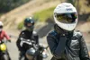 Three people on motorcycles on a road. Náhled obrázku produktu