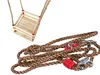 A wooden swing seat and a coiled rope with metal connectors are displayed against a white background. Produktbild-Vorschau