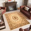 A living room scene with a fireplace, sofa, armchair, and a rug.