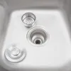 A close-up view of a stainless steel sink with a drain assembly and accessories. Podgląd zdjęcia produktu