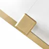 A close-up shot of a gold-colored shower cabin frame with a square detail. Náhľad obrázku produktu