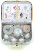 A children's toy tea set laid out inside a light blue suitcase. Produktbild-Vorschau