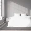 A neatly made bed with white striped satin bedding, set against a plain gray wall with window light casting shadows. Produktbild-Vorschau