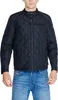 A man wearing a black quilted jacket and blue jeans. Produktbild-Vorschau