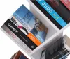 A close-up view of a white, multi-tiered bookshelf filled with various books. Náhľad obrázku produktu