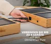 A hand is plugging a power cord into a grill, with text overlaying the image. Produktbild-Vorschau