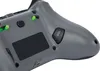 Close-up view of the back of a gray video game controller. Produktbild-Vorschau