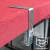 A close-up of a stainless steel table cloth clamp attached to a red tablecloth. Produktbild-Vorschau