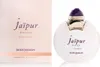 A perfume box and bottle are displayed side-by-side against a white background. Voir les images du produit