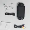 A handheld game console and its accessories are laid out on a white surface. Produktbild-Vorschau