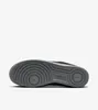The underside of a black Nike Air Force 1 sneaker with a grey sole. Anteprima dell’immagine prodotto