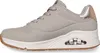 A side view of a gray Skechers sneaker with a white sole and brown outsole. Produktbild-Vorschau