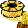 A spool of yellow LED rope lights is shown, with a decorated Christmas tree in the background. Produktbild-Vorschau