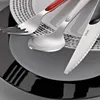 A close-up view of cutlery on plates. Náhled obrázku produktu