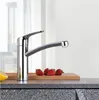 A kitchen faucet with strawberries and a lemon slice on a countertop. Produktbild-Vorschau