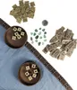 A collection of game pieces and stones arranged on a blue cloth with a decorative border. Podgląd zdjęcia produktu