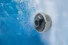 A close-up of a jet nozzle in a hot tub, with water and bubbles visible. Produktbild-Vorschau