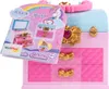 A toy makeup case with a booklet showing its contents. Produktbild-Vorschau