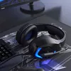 A gaming headset, keyboard, and mouse are arranged on a desk mat with a monitor in the background. Náhled obrázku produktu