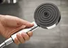 A hand holding a shower head. Anteprima dell’immagine prodotto