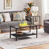 A living room scene with a sofa, coffee table, and side table. Produktbild-Vorschau