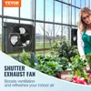 A woman in a greenhouse tending to plants, with an exhaust fan mounted on the wall. Podgląd zdjęcia produktu
