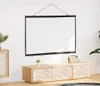 A projection screen is mounted on a white wall above a wooden media console in a modern living room. Anteprima dell’immagine prodotto