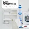 A laundry room scene with a white shelving unit, a laundry basket, a washing machine, and a blue drying rack. Produktbild-Vorschau