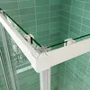 Close-up of a shower enclosure corner with green tiled walls. Produktbild-Vorschau