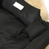 A close-up view of a black dog bed with a small pillow. Anteprima dell’immagine prodotto
