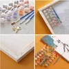A collage of images showing a paint-by-numbers kit for 'The Witcher'. Produktbild-Vorschau