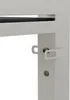 A close-up view of a white metal bracket with a locking mechanism, attached to a white vertical support. A dark horizontal element is visible in the background. Produktbild-Vorschau