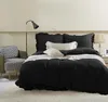 A bedroom scene with a bed, chair, and lamp. Produktbild-Vorschau