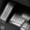 Close-up view of car floor mats and a car pedal. Produktbild-Vorschau