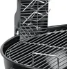 A close-up view of a stainless steel grill accessory, likely a rack or holder, positioned inside a black grill. Náhľad obrázku produktu
