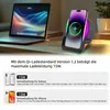 A wireless charger with a phone on it, next to a laptop. Produktbild-Vorschau