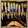 A wand is casting a spell, causing floating LED candles to illuminate a grand hall with stained glass windows. Produktbild-Vorschau
