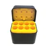 A black and yellow battery charger with its lid open, showing eight battery slots. Produktbild-Vorschau