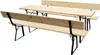 A wooden picnic table and benches set with black metal legs, shown from a slightly elevated side angle against a white background. Produktbild-Vorschau