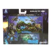 The image shows the packaging of a McFarlane Toys Avatar Amp Suit and Colonel Miles Quaritch action figure set. The packaging features a diorama-like display of the product with jungle scenery and flying creatures. Náhled obrázku produktu