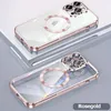 Two clear phone cases with rose gold trim and magnetic rings are displayed on a white and gray surface. Produktbild-Vorschau