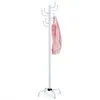 A white coat rack with a pink jacket hanging on it, isolated on a white background. Náhled obrázku produktu