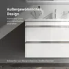 A close-up shot of a white, glossy bathroom vanity with two drawers, featuring text overlays describing its design and origin. Produktbild-Vorschau