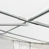 Close-up view of the metal frame structure of a tent, showing the joints and poles under a white fabric roof. Produktbild-Vorschau